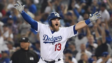 Max Muncy #13 of the Los Angeles Dodgers celebrates his eighteenth-inning walk-off home run to defeat the the Boston Red Sox 3-2 in Game Three of the 2018 World Series at Dodger Stadium on October 26, 2018 in Los Angeles, Cal