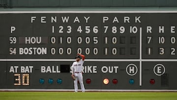 Oct 20, 2021; Boston, Massachusetts, USA; Boston Red Sox left fielder Alex Verdugo (99) stands in front of the Green Monster scoreboard during the ninth inning of game five of the 2021 ALCS against the Houston Astros at Fenway Park. Mandatory Credit: Bob 