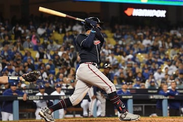 Oct 20, 2021; Los Angeles, California, USA; Atlanta Braves left fielder Eddie Rosario (8) hits a three run home run in the ninth inning against the Los Angeles Dodgers in game four of the 2021 NLCS at Dodger Stadium. Mandatory Credit: Kirby Lee-USA TODAY 